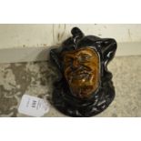 A small pottery wall mask "The Jester".