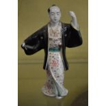A Japanese porcelain figure.