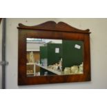 A mahogany framed mirror.