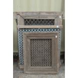 A quantity of Indian hardwood framed wrought iron window grilles.