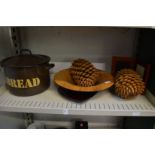 Decorative items to include a pair of very large pine cones.