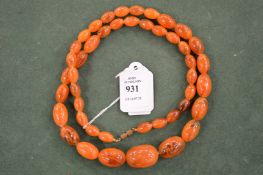 An amber style bead necklace.