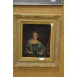 A seated female figure holding a book, oil on canvas in a decorative gilt frame.