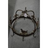 A good wrought iron circular pot hook.