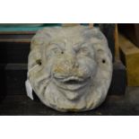 A cast lead lion's mask wall mounted fountain head.