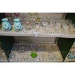 A quantity of glassware to include a pair of enamel decorated green opaque vases.