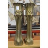 Trench art, a pair of brass shell cases fashioned as vases.