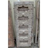 A good large pair of Indian carved hardwood doors with wrought iron mounts.