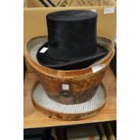 A leather cased top hat, internal measurement 7.5ins x 6ins.