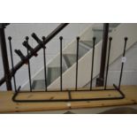A wrought iron boot rack.
