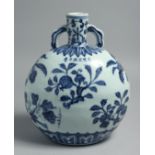 A CHINESE BLUE AND WHITE PORCELAIN TWIN HANDLE MOON FLASK, decorated with sprays of various