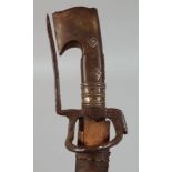 AN ANTIQUE ETHIOPIAN RHINO HORN HILTED SWORD, with leather and wood scabbard, 101cm overall.