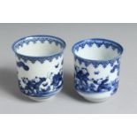 A NEAR-PAIR OF JAPANESE HIRADO BLUE AND WHITE PORCELAIN CUPS, each decorated with boys playing in
