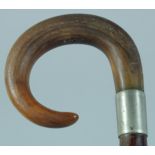 AN ANTIQUE RHINO HORN HANDLE WALKING STICK.