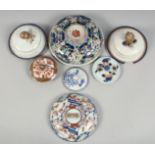 A COLLECTION OF SEVEN CHINESE AND JAPANESE PORCELAIN COVERS, various sizes, (7).