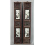 A PAIR OF EARLY 20TH CENTURY FRAMED DOUBLE PORCELAIN PANELS, each wooden frame encasing two panels