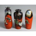 THREE JAPANESE SUMIDA POTTERY VASES, partly glazed with ribbed body and figures in relief, one