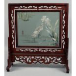 A LARGE CHINESE WOODEN TABLE SCREEN with embroidered panel depicting cranes, 49cm wide, 54.5cm