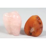 A NATURALISTIC FORM ROSE QUARTZ PIECE, together with another hard stone, (2).