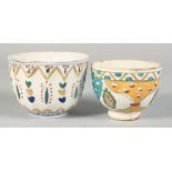TWO TURKISH KUTAHYA POTTERY BOWLS, each painted with decorative floral motifs, 10cm and 9cm