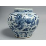 A CHINESE BLUE AND WHITE PORCELAIN JAR, decorated with beasts and flora, 15.5cm high.