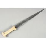 A FINE LARGE 18TH CENTURY OTTOMAN WALRUS HILTED DAGGER, with engraved steel blade, 49cm long.