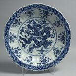 A LARGE CHINESE BLUE AND WHITE PORCELAIN DISH, with petal form rim, the centre painted with a