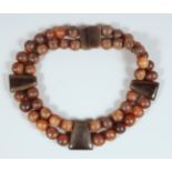 AN ANTIQUE RHINO HORN BEADED NECKLACE.**Please note: this item can only be sold within the UK**