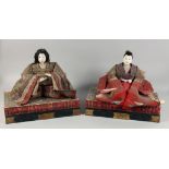 A PAIR OF JAPANESE CARVED AND LACQUERED WOOD MARRIAGE DOLLS, each with embroidered robes and include