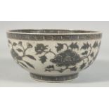 A CHINESE CRACKLE GLAZE PORCELAIN BOWL, decorated with large flower heads and scrolling vine, 20cm