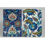TWO TURKISH IZNIK GLAZED POTTERY TILES, each decorated with floral motifs, 23.5cm x 16cm and 24cm