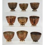 NINE 18TH/19TH CENTURY TURKISH OTTOMAN TOMBAK ZARF CUPS, each approx. 5.5cm diameter, (9).