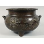 A LARGE JAPANESE BRONZE TWIN HANDLE TRIPOD CENSER, with relief decoration depicting a dragon and