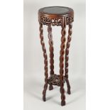 A CHINESE MARBLE INSET HARDWOOD STAND, with carved and pierced rope twist legs united by a similarly