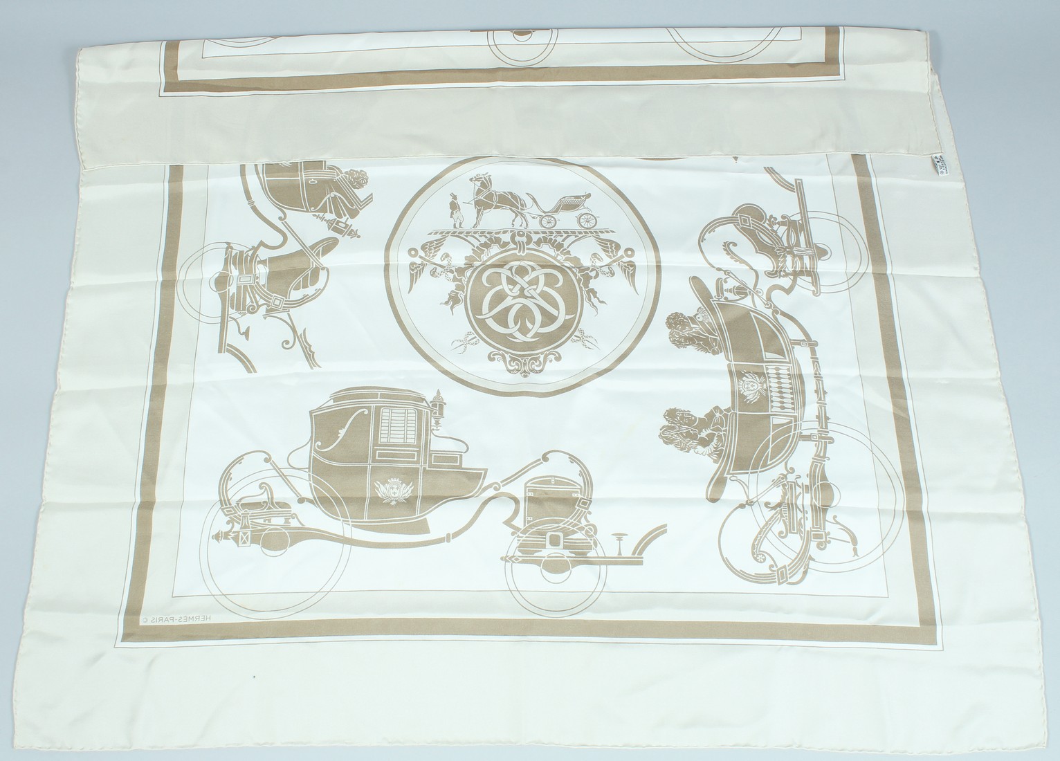 A HERMES SILK SCARF, horse and carriage. 32ins x 32ins.