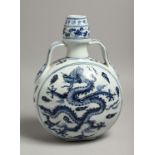 A CHINESE BLUE AND WHITE MOON FLASK decorated with a dragon. 11.5ins high x 7.5ins diameter.