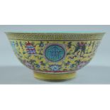 A CHINESE BOWL with yellow enamel ground. 6.5ins diameter.