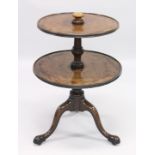 A GEORGIAN MAHOGANY CIRCULAR TWO TIER DUMB WAITER centre turned support ending in tripod legs with