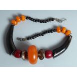 AN AMBER AND HORN NECKLACE.