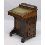 A GOOD VICTORIAN WALNUT DAVENPORT, brass grill, leather writing surface, fitted interior, four