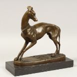 A BRONZE GREYHOUND on a marble base. 9ins high.