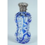 A VICTORIAN BLUE GLASS SCENT BOTTLE with silver top. 8cm long.