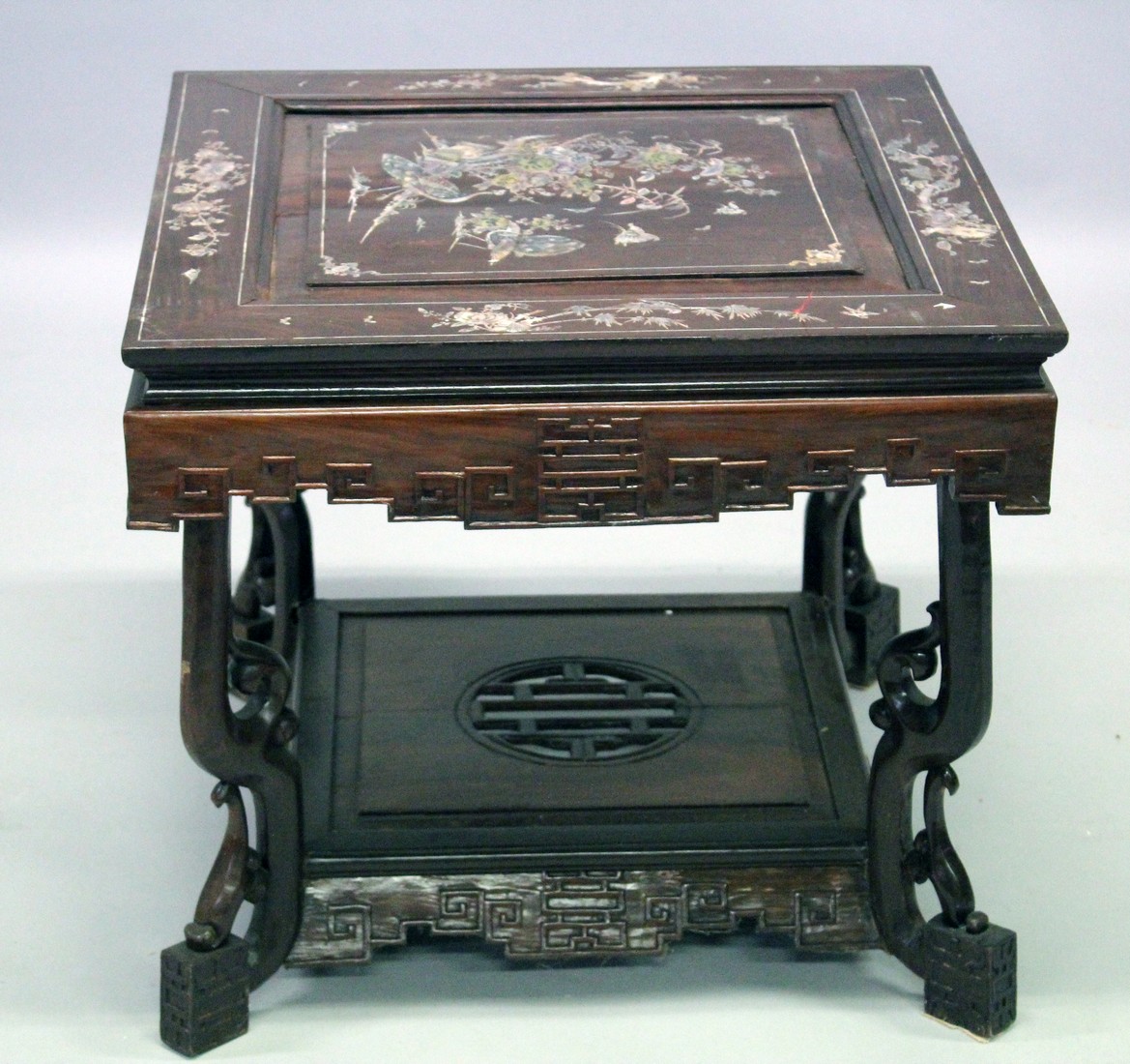 A CHINESE SQUARE TWO TIER TABLE inlaid with mother of pearl. 23ins square.