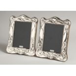 A PAIR OF SILVER ART DECO PHOTOGRAPH FRAMES. 7.5ins x 6ins.