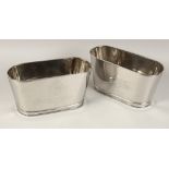 A SMALL PAIR OF LILY BOLLINGER ICE BUCKETS. 11.5ins wide.