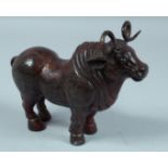 A CHINESE BRONZE STANDING BULL 9ins long.