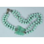 A JADE BUTTERFLY NECKLACE.