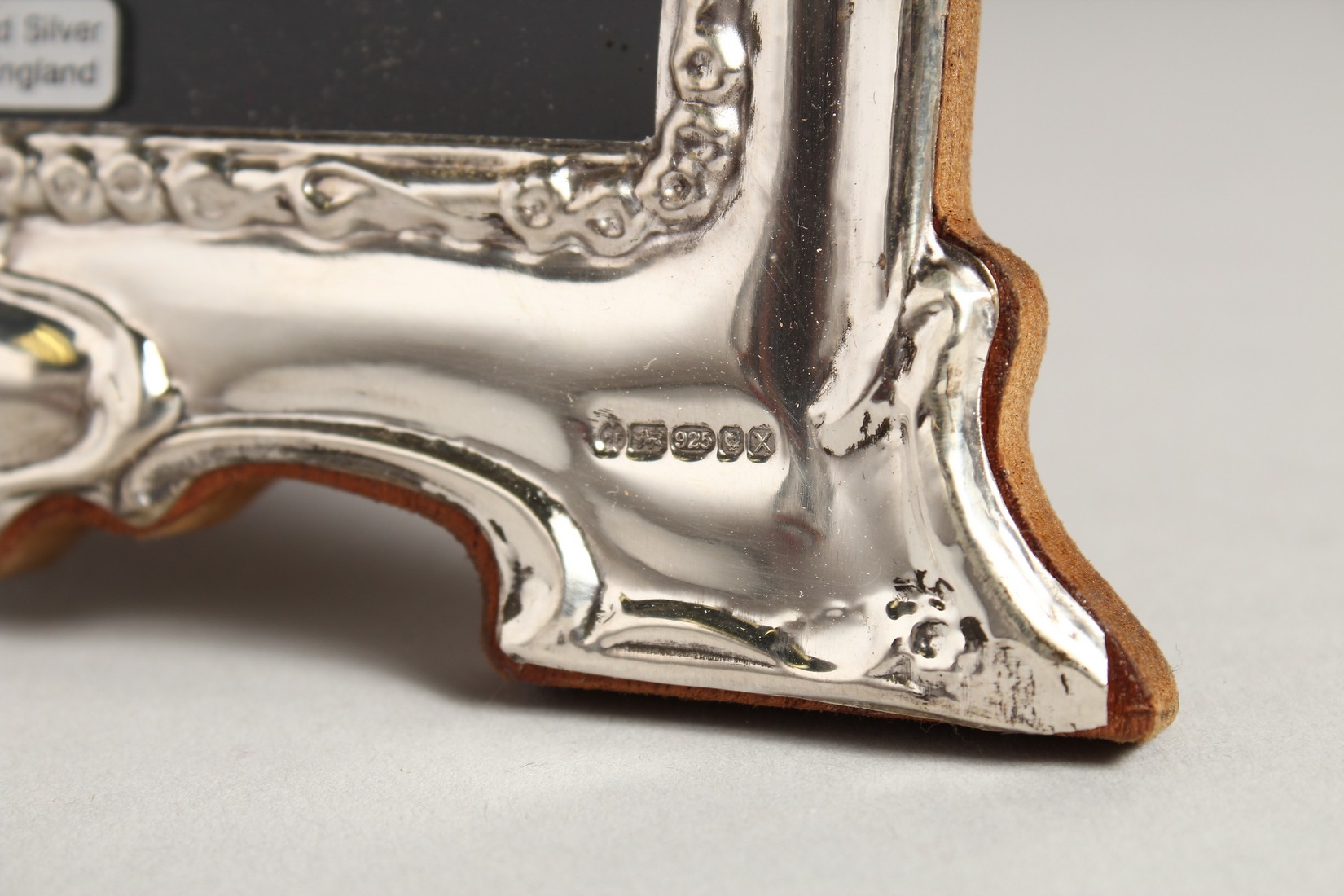 A PAIR OF SILVER SCROLLING PHOTOGRAPH FRAMES. 8ins x 6ins. - Image 2 of 3