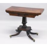 A REGENCY MAHOGANY CARD TABLE with cross band top and green baize interior, on a centre column