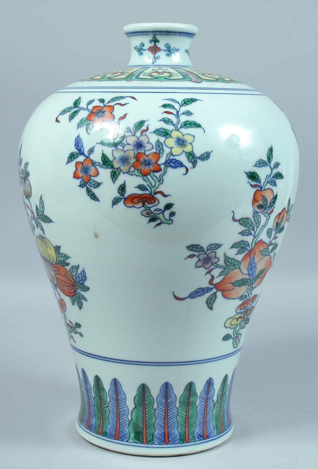 A LARGE CHINESE DOUCAI MEIPING decorated with panels of flowers. 15ins high.
